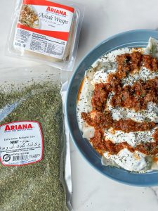 Ashak, a beloved Afghan dish of delicate dumplings filled with leeks and herbs. Served with hearty tomato sauce, creamy garlicky yogurt, and a sprinkle of aromatic dried mint. Savor the goodness of Ashak!