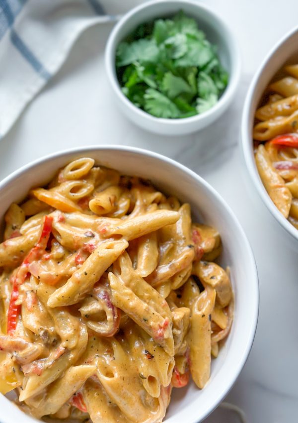 Our creamy Chicken Fajita Pasta recipe combines all the flavors you love from classic chicken fajitas with a creamy and cheesy pasta sauce that’s sure to please. It’s been a go-to recipe in our own household for a while, and we’re excited to share it with you! With the perfect blend of seasonings and creamy goodness, this dish is bound to become a household favorite for you too. Give it a try tonight!