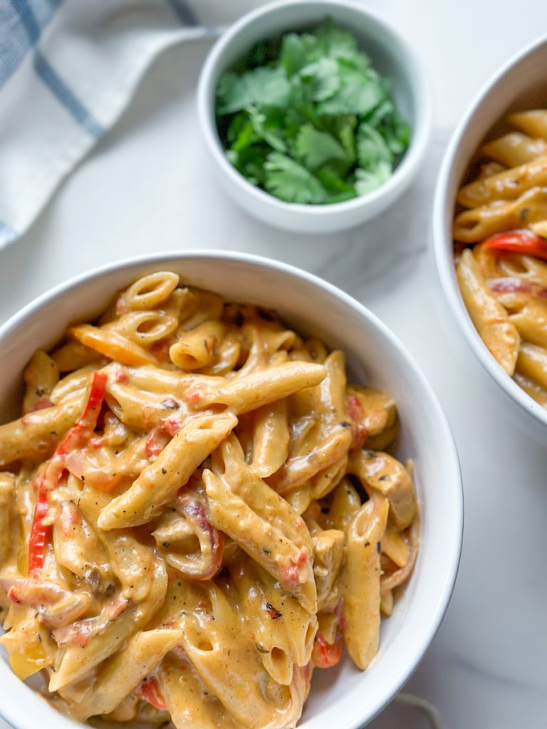 Our creamy Chicken Fajita Pasta recipe combines all the flavors you love from classic chicken fajitas with a creamy and cheesy pasta sauce that’s sure to please.
It’s been a go-to recipe in our own household for a while, and we’re excited to share it with you! With the perfect blend of seasonings and creamy goodness, this dish is bound to become a household favorite for you too. Give it a try tonight!