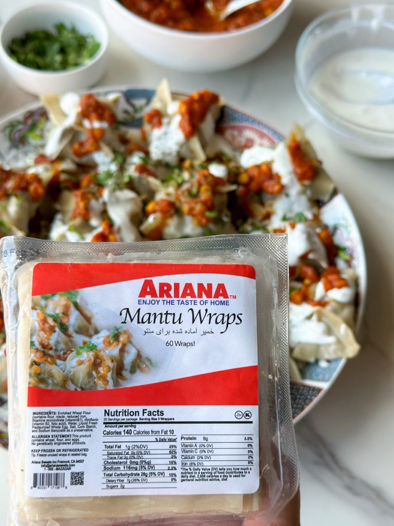 a plate full of Mantu with a sauce being poured over it and Ariana Sweets mantu wraps